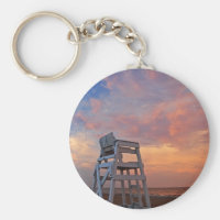 Lifeguard chair with dramatic sky. keychain