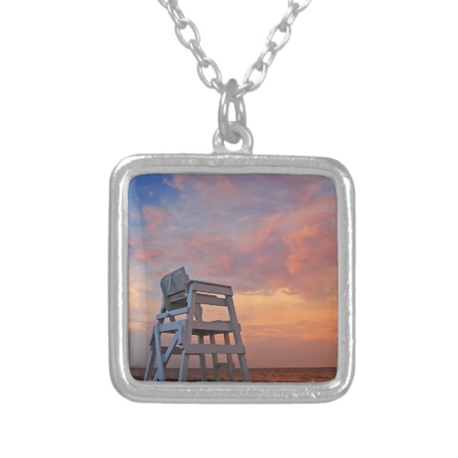 Lifeguard chair with dramatic sky. silver plated necklace (Front)