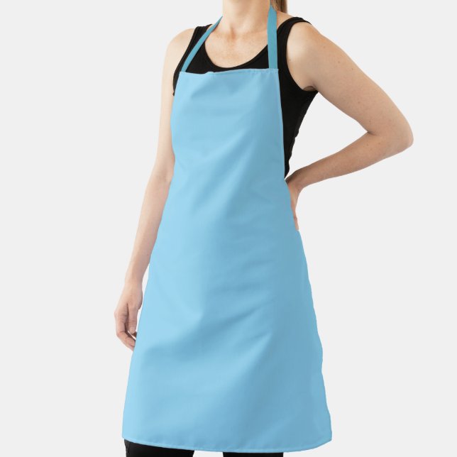 light blue apron with a simple, clean design (Insitu)