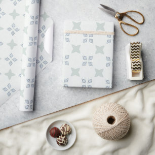 Light blue geometric floral tile pattern on white wrapping paper