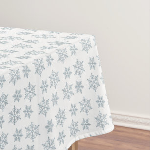 Light Blue Snowflake Pattern on White Tablecloth