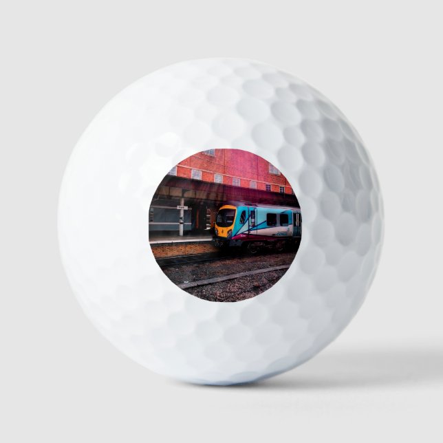 Light blue train at the station golf balls (Front)