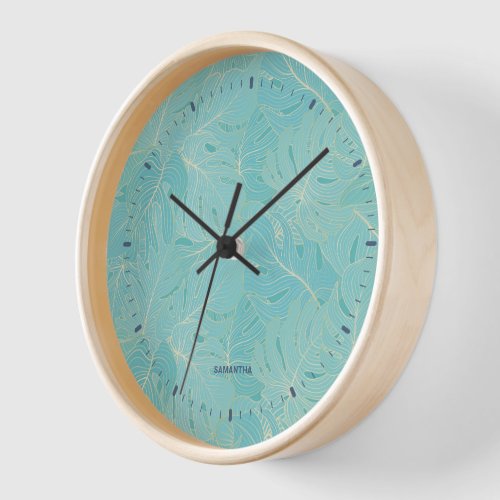 Light blue tropical palm leaves pattern clock