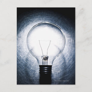 Light Bulb on Stainless Steel Background Postcard