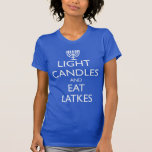 LIGHT CANDLES AND EAT LATKES T-Shirt<br><div class="desc">Fun for Chanukah. LIGHT CANDLES AND EAT LATKES with a menorah. Design based on the 1939 British morale.</div>