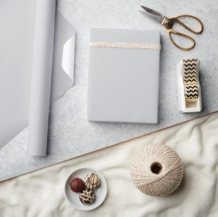 light gray sheet or backdrop wrapping paper