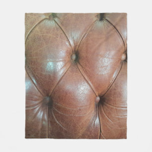 Light on brown leather sofa surface, textureabstra fleece blanket