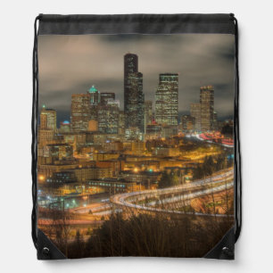 Light streaks from cars at night drawstring bag