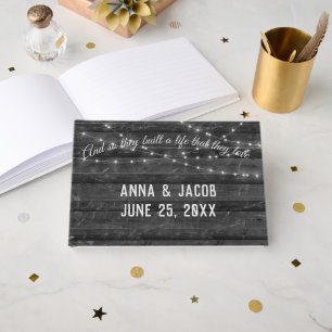 Light String On Dark Gray Wood Wedding  Guest Book
