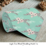 Light Teal Floral Wedding  Neck Tie<br><div class="desc">Add a refined touch to your wedding attire with this light teal floral wedding necktie, designed for timeless elegance. The soft teal backdrop paired with delicate floral detailing creates a sophisticated yet romantic look, perfect for grooms, groomsmen, or special guests. Its versatile shade complements a wide range of suit colors,...</div>