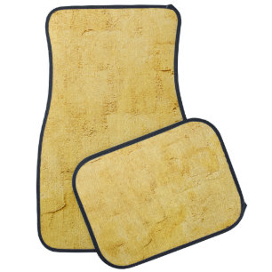 light yellow abstract textured plaster on the wall car floor mat