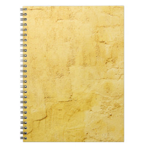 light yellow abstract textured plaster on the wall notebook