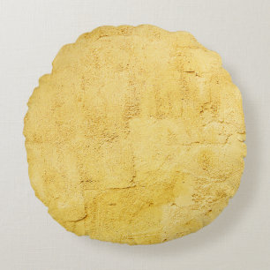 light yellow abstract textured plaster on the wall round pillow