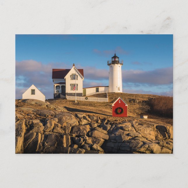 Lighthouse at Sunset with Christmas Decorations Holiday Postcard (Front)