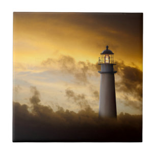 Lighthouse Glowing under Dramatic Sky Ceramic Tile