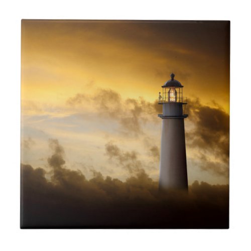 Lighthouse Glowing under Dramatic Sky Ceramic Tile