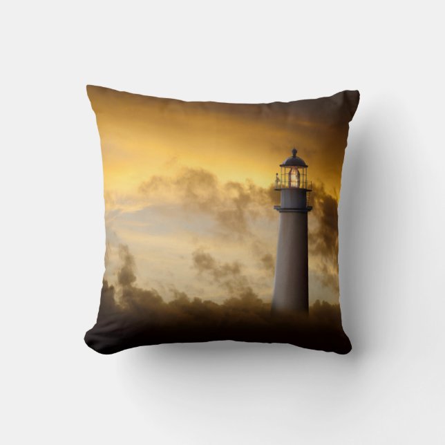 Lighthouse Glowing under Dramatic Sky Throw Pillow (Front)