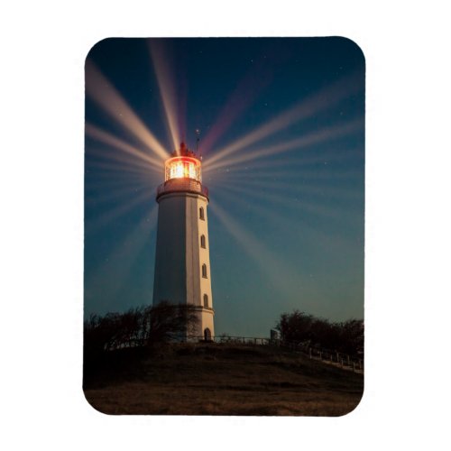 Lighthouse on a Hill Shining at Night Magnet