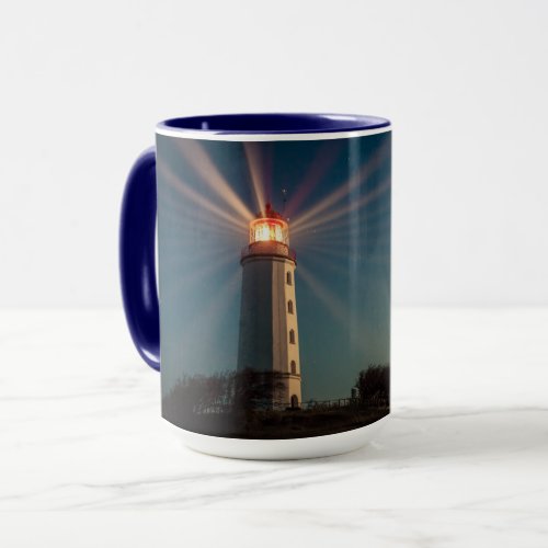 Lighthouse on a Hill Shining at Night Mug