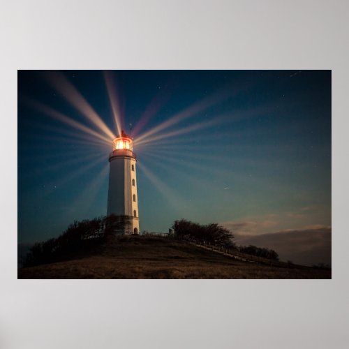 Lighthouse on a Hill Shining at Night Poster