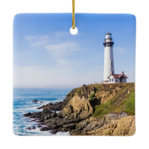 Lighthouse on hill blue sky white house ocean ceramic ornament