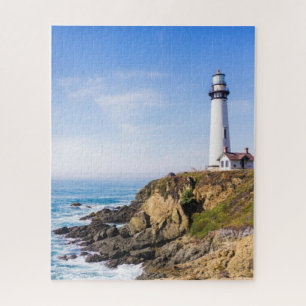 Lighthouse on hill blue sky white house ocean jigsaw puzzle