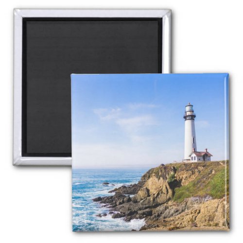 Lighthouse on hill blue sky white house ocean magnet