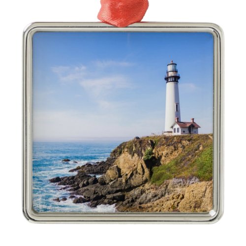 Lighthouse on hill blue sky white house ocean metal ornament