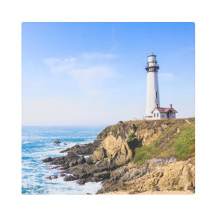 Lighthouse on hill blue sky white house ocean metal print