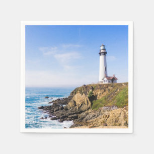 Lighthouse on hill blue sky white house ocean napkins