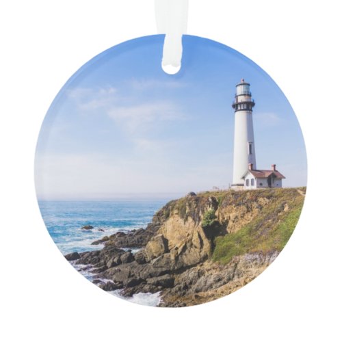 Lighthouse on hill blue sky white house ocean ornament