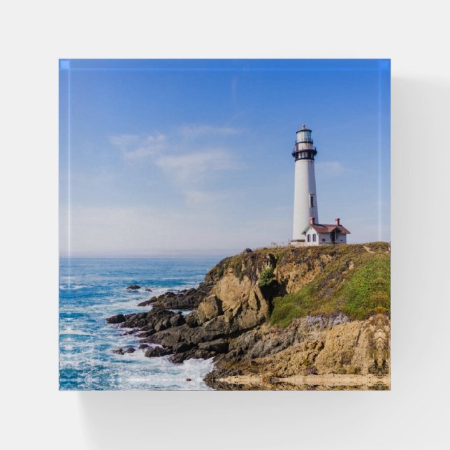 Lighthouse on hill blue sky white house ocean paperweight (Front)