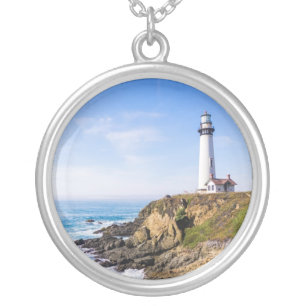 Lighthouse on hill blue sky white house ocean silver plated necklace