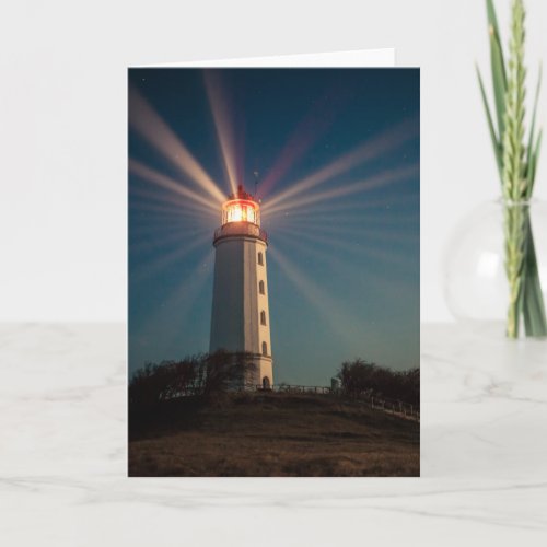 Lighthouse on Hill Shining at Night Card