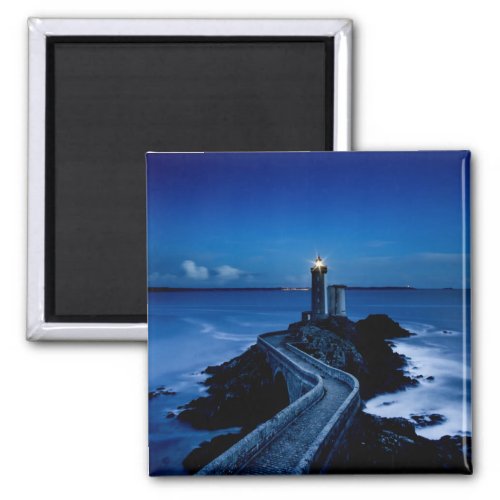 Lighthouse on wall in ocean at night magnet