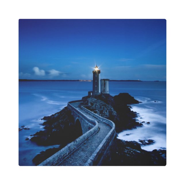 Lighthouse on wall in ocean at night metal print (Front)