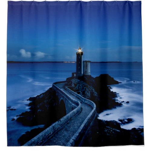 Lighthouse on wall in ocean at night shower curtain