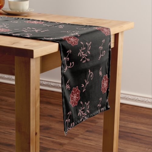Lila blush and wine flower with leaves on black short table runner