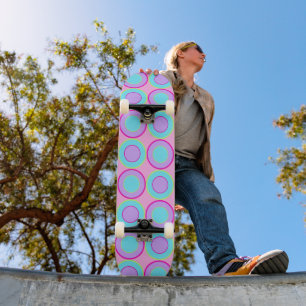 Lilac And Turquoise Donuts With Filling On Pink Skateboard
