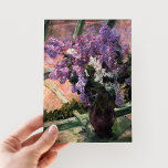 Lilacs in a Window | Mary Cassatt Postcard<br><div class="desc">Lilacs in a Window (1880) by Mary Cassatt is a delicate still-life painting that showcases a vase filled with vibrant lilacs placed near a window. The artwork captures the beauty of fresh blooms and the gentle light filtering through the glass, evoking a sense of tranquility. Cassatt’s careful attention to detail...</div>