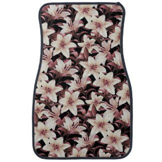 Lilies on black car floor mat