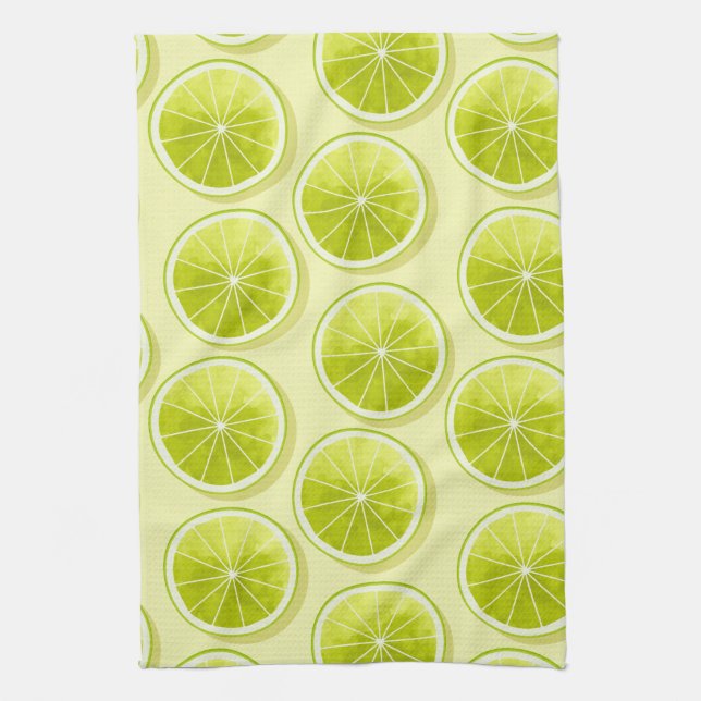 Lime Slices on Light Yellow Kitchen Towel (Vertical)