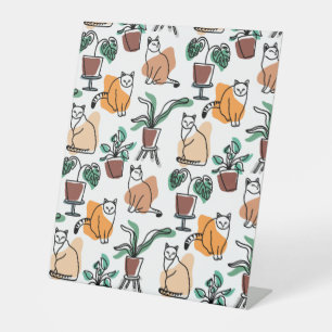 Line art drawing cats and flowers pedestal sign