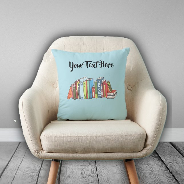 Line of Numerous Colourful Books on Light Blue Throw Pillow (Row of multiple colourful books on light blue decorative pillow for avid readers.)