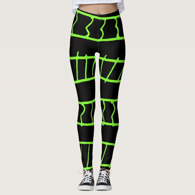 Lines and shapes pattern over black background leggings (Front)