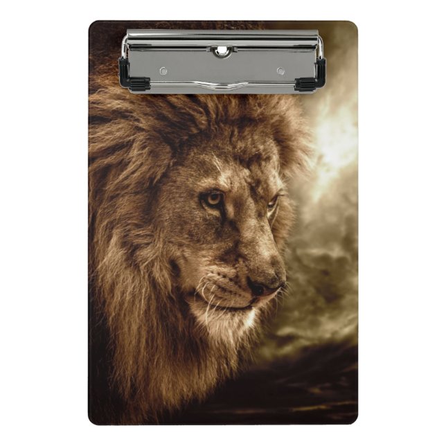 Lion against stormy sky mini clipboard (Front)