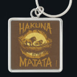 Lion King | "Hakuna Matata" Woodcut Design Keychain<br><div class="desc">This woodcut stylized design features the iconic scene with Simba,  Pumbaa,  and Timon crossing a log in the jungle with the words "Hakuna Matata" featured boldly around the graphic.</div>