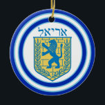 Lion of Judah Emblem Ariel Hebrew Ceramic Ornament<br><div class="desc">Round ceramic ornament with an image,  on both sides,  of a blue and yellow Lion of Judah emblem on white with light blue and dark blue borders and “Ariel” in Hebrew in blue letters above it. See the entire Hanukkah Ornament collection under the HOME category in the HOLIDAYS section.</div>