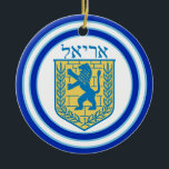 Lion of Judah Emblem Ariel Hebrew Ceramic Ornament<br><div class="desc">Round ceramic ornament with an image,  on both sides,  of a blue and yellow Lion of Judah emblem on white with light blue and dark blue borders and “Ariel” in Hebrew in blue letters above it. See the entire Hanukkah Ornament collection under the HOME category in the HOLIDAYS section.</div>