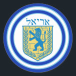 Lion of Judah Emblem Ariel Hebrew Sticker<br><div class="desc">Round sticker with an image of a blue and yellow Lion of Judah emblem with Ariel in Hebrew at the top, and wide double blue borders trimmed in light blue on white. See matching confetti, label and wrapping paper. See the entire Hanukkah Sticker collection under the CARDS & STICKERS category...</div>